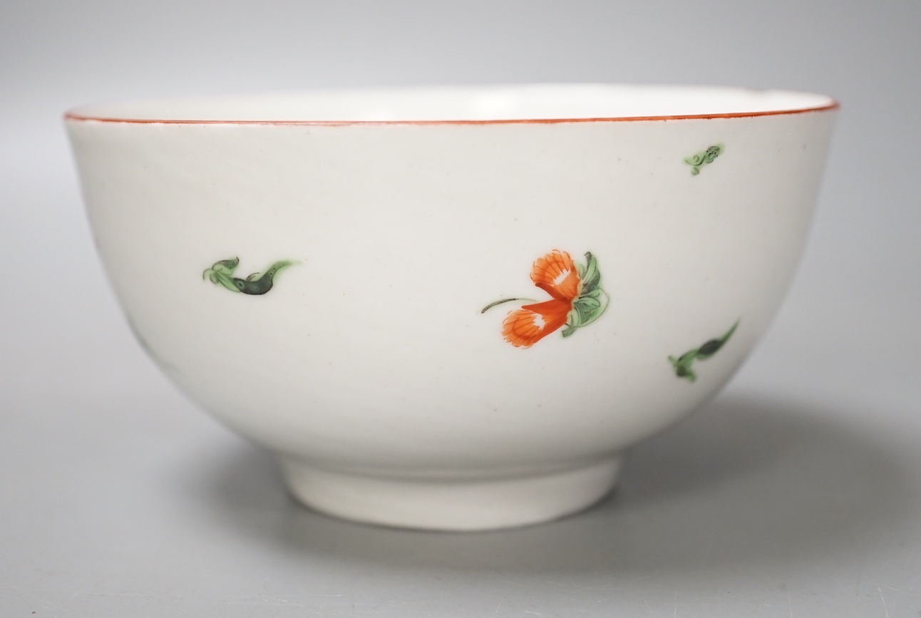 A Bristol porcelain bowl painted with a spray of flowers and scattered sprigs, crossed swords dot mark in under-glaze blue c.1775
